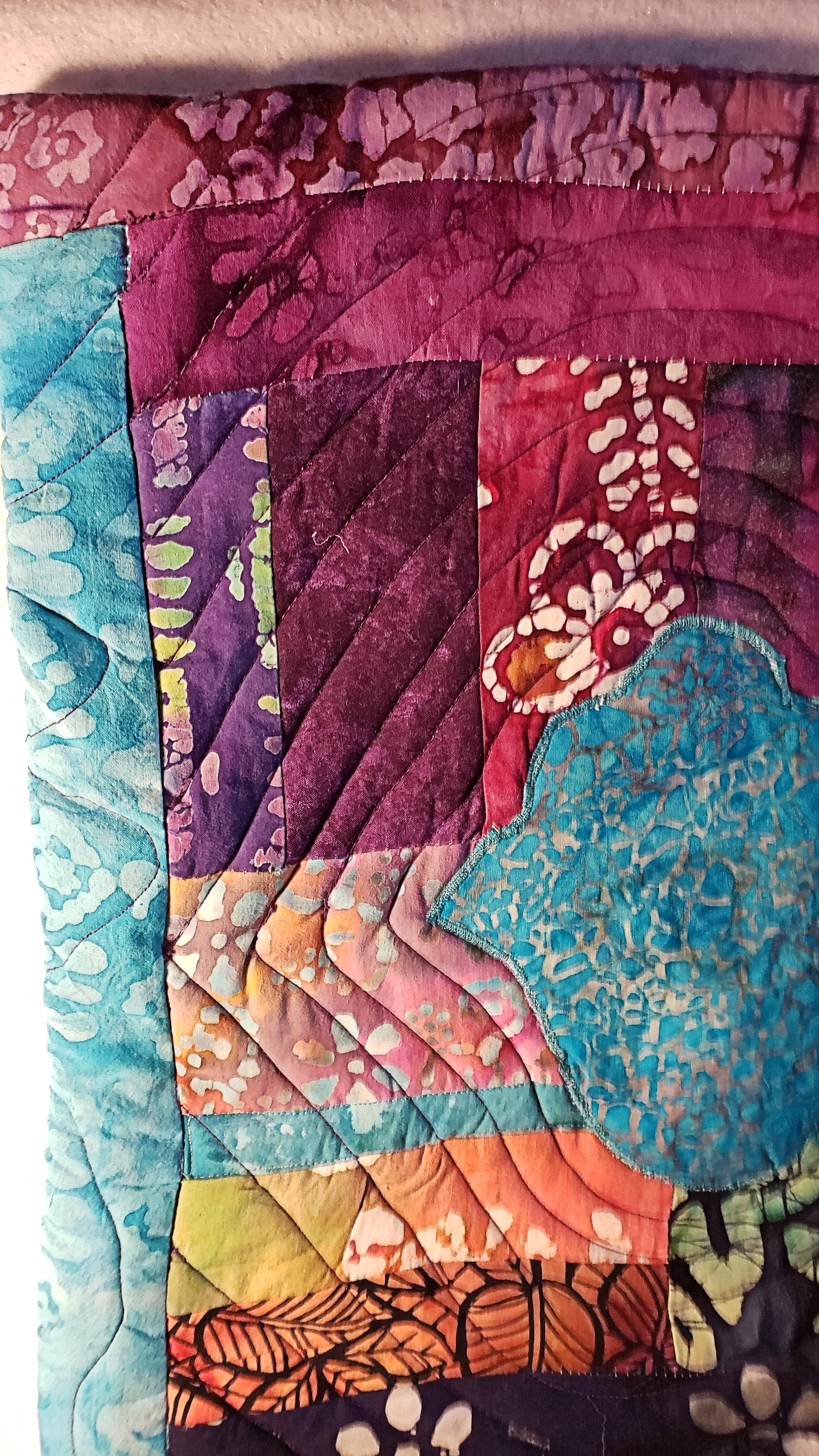 turquoise hamsa ripples in all batik trapunto wall hanging