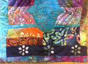 turquoise hamsa ripples in all batik trapunto wall hanging