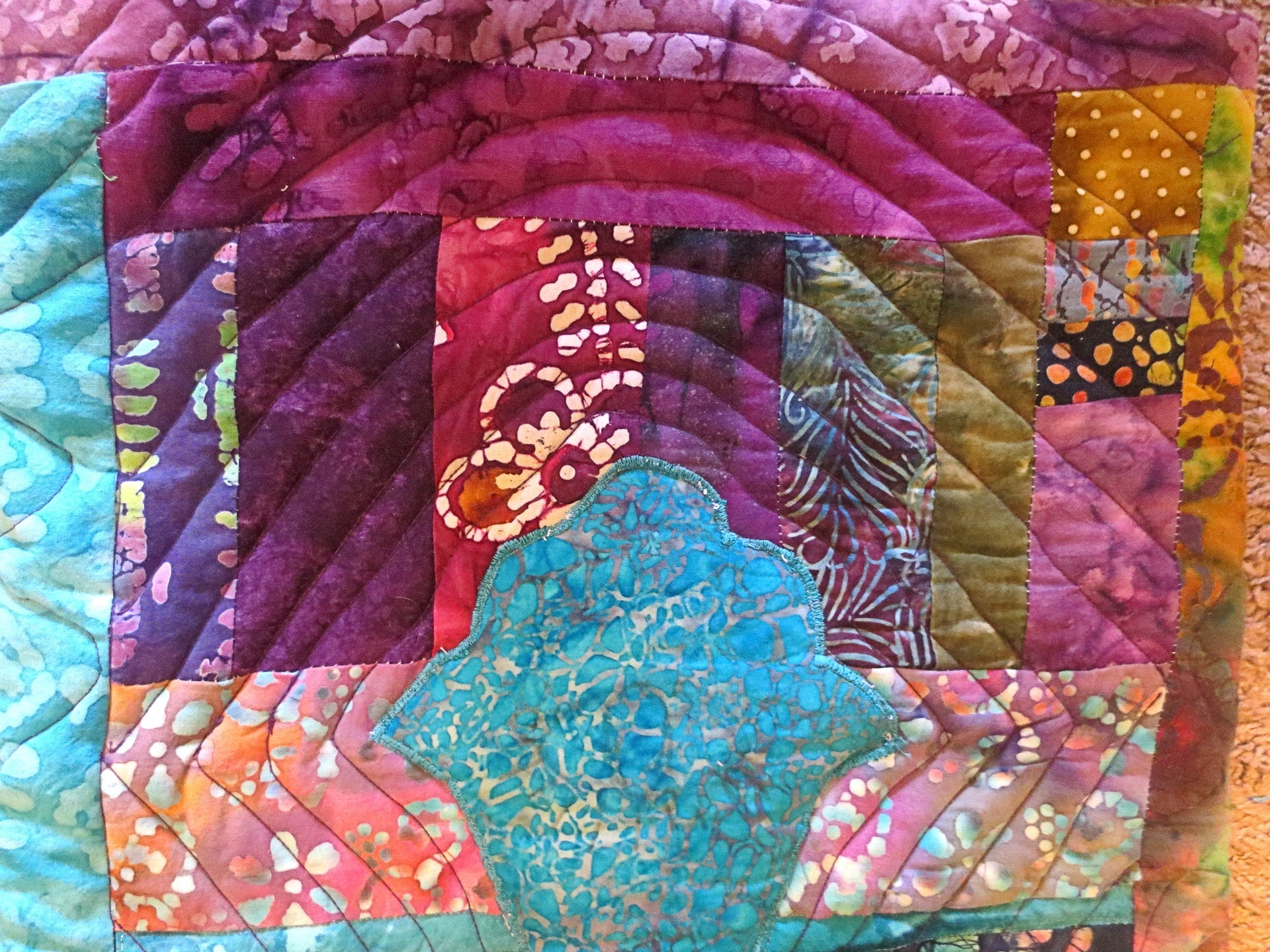 turquoise hamsa ripples in all batik trapunto wall hanging