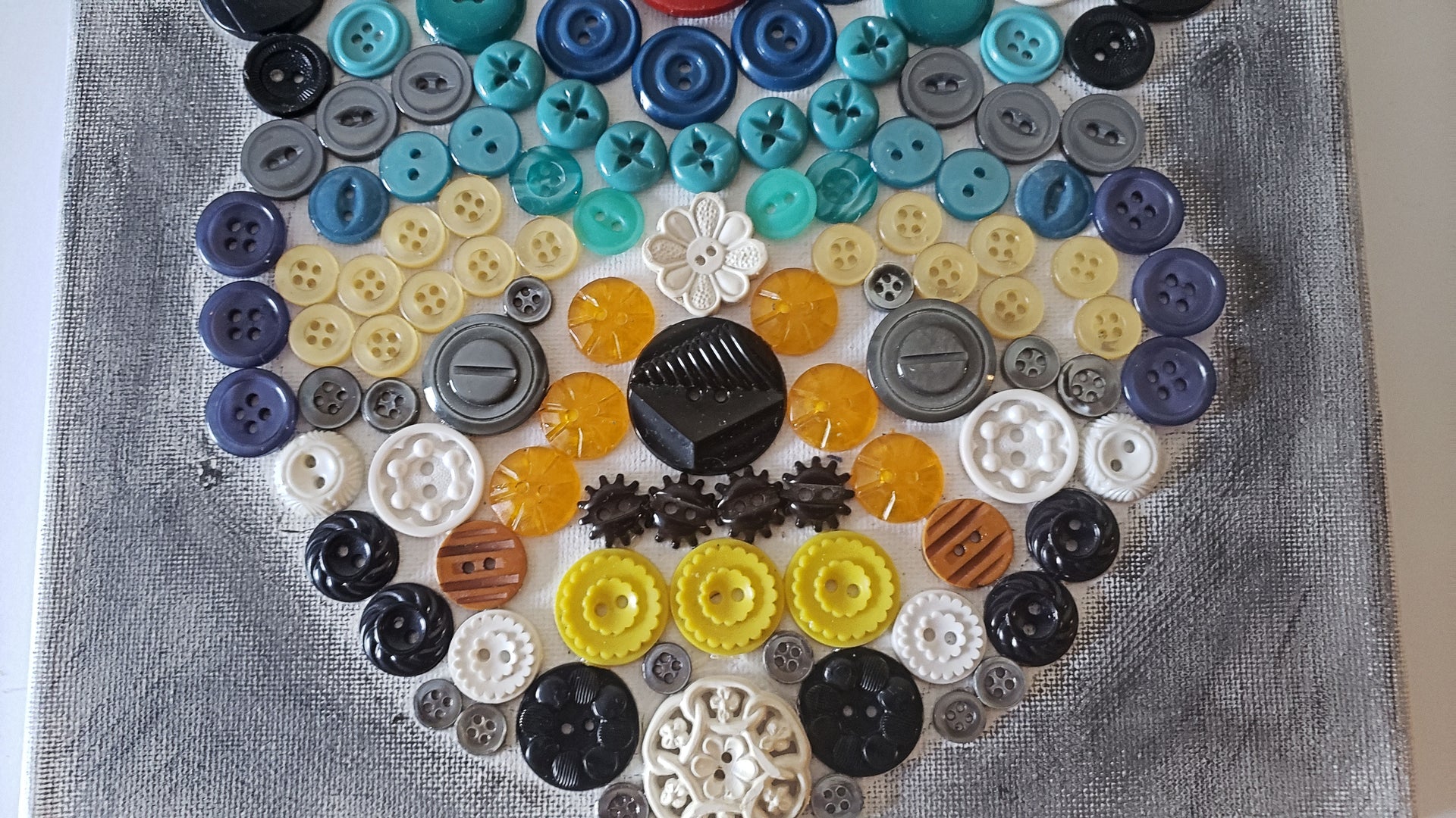 hamsa multicolored button art work with vintage buttons on canvas hand of miriam