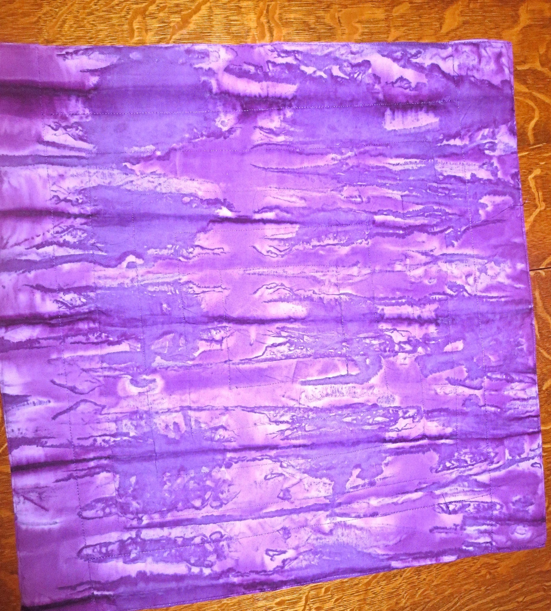 all purples batiks quilted insulated log cabin table runner with a splash of color