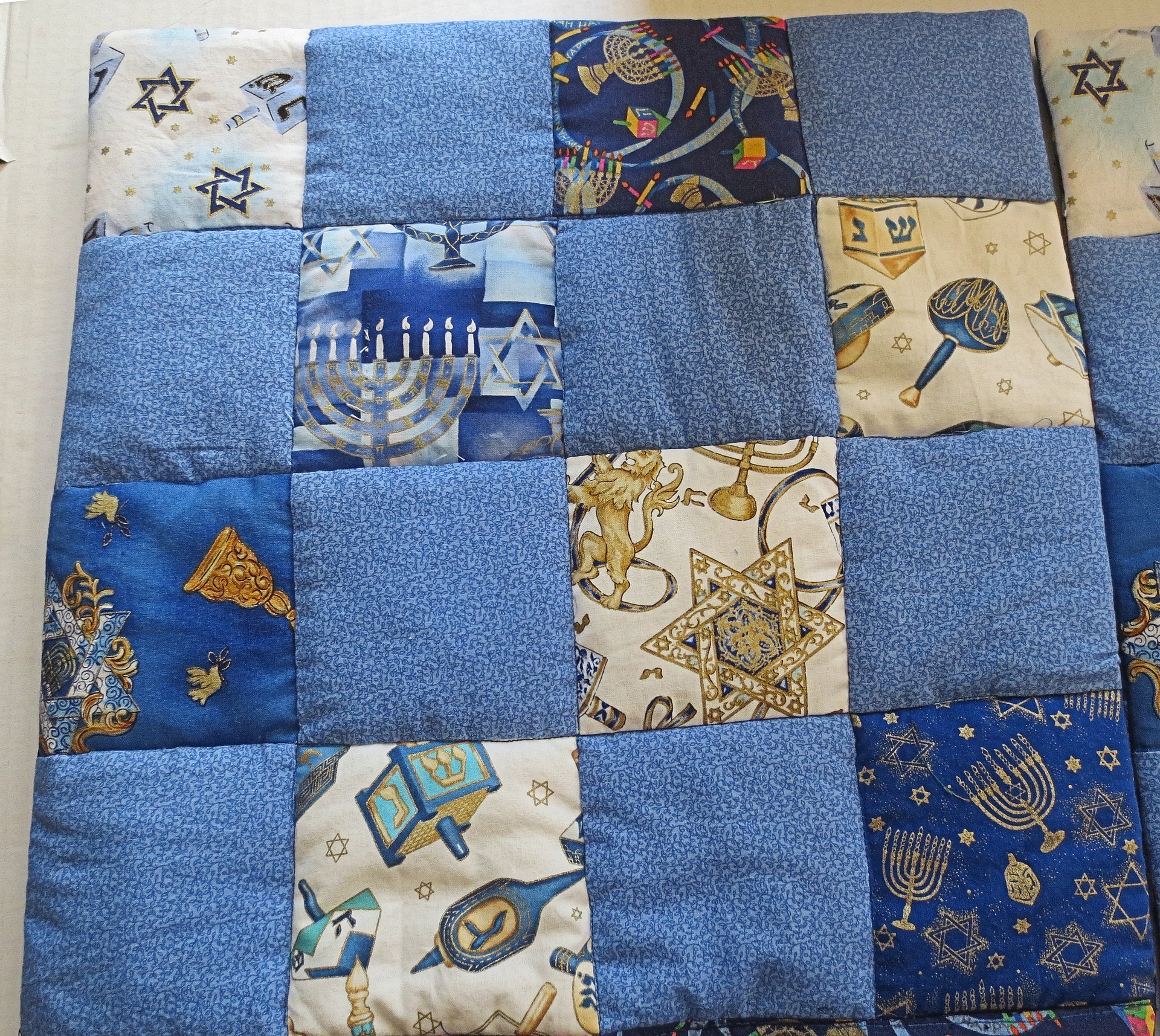 hanukkah quilted pillow cover patchwork dreidels menorahs metallic golds blues reversible