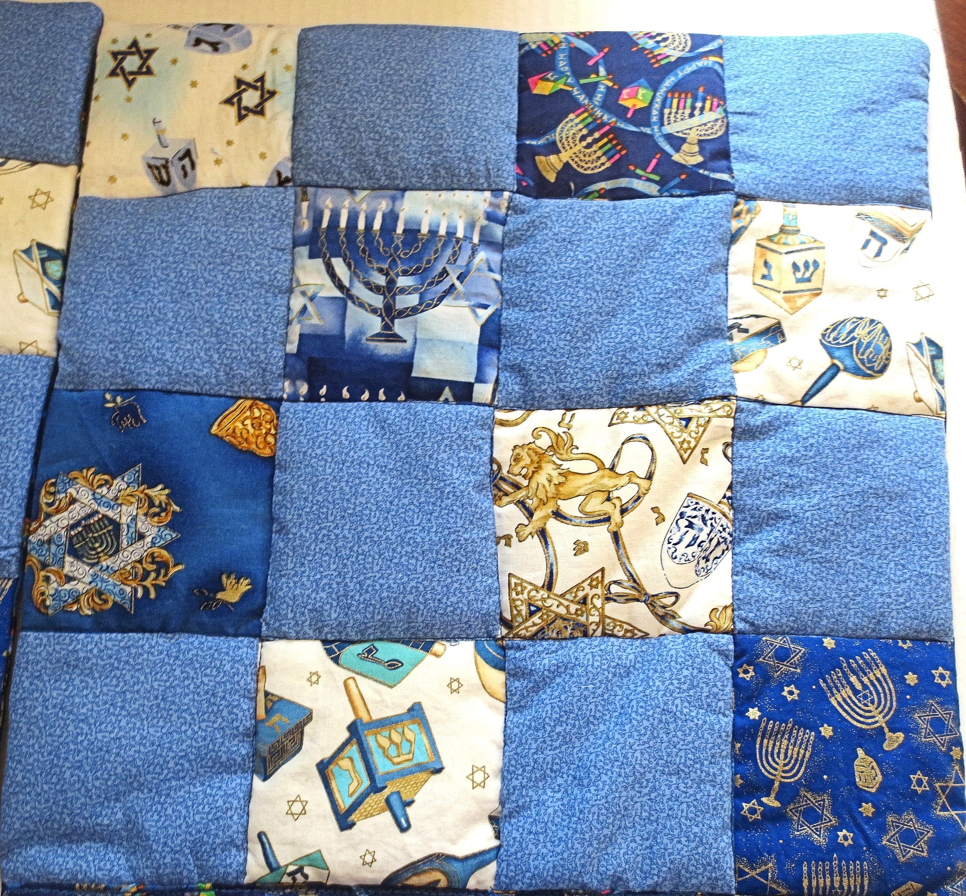 hanukkah quilted pillow cover patchwork dreidels menorahs metallic golds blues reversible