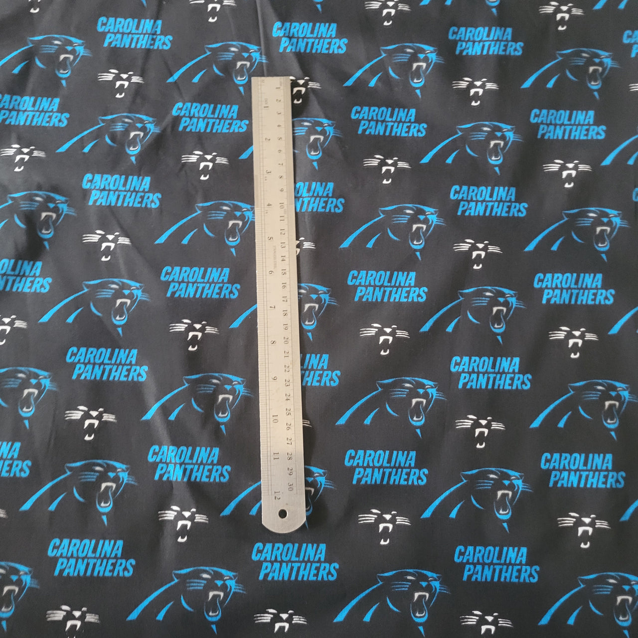 NFL Carolina Panthers cotton quilting fabric by half yard x 58" wide football
