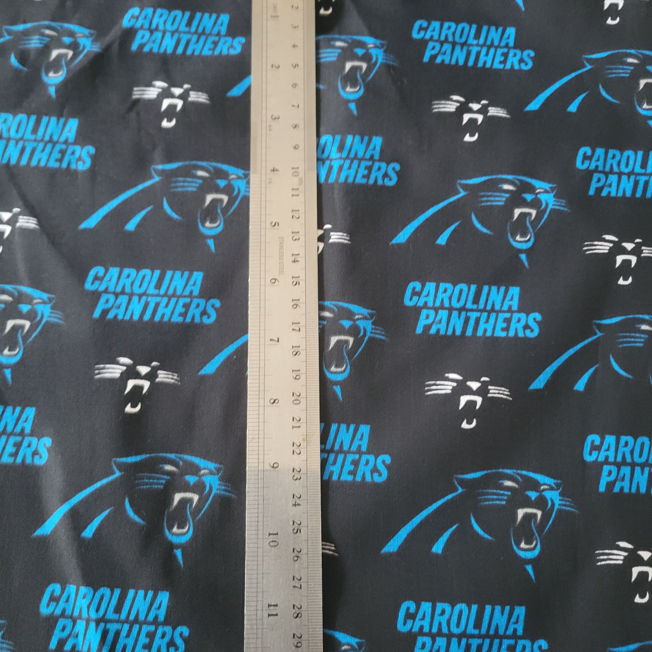NFL Carolina Panthers cotton quilting fabric by half yard x 58" wide football