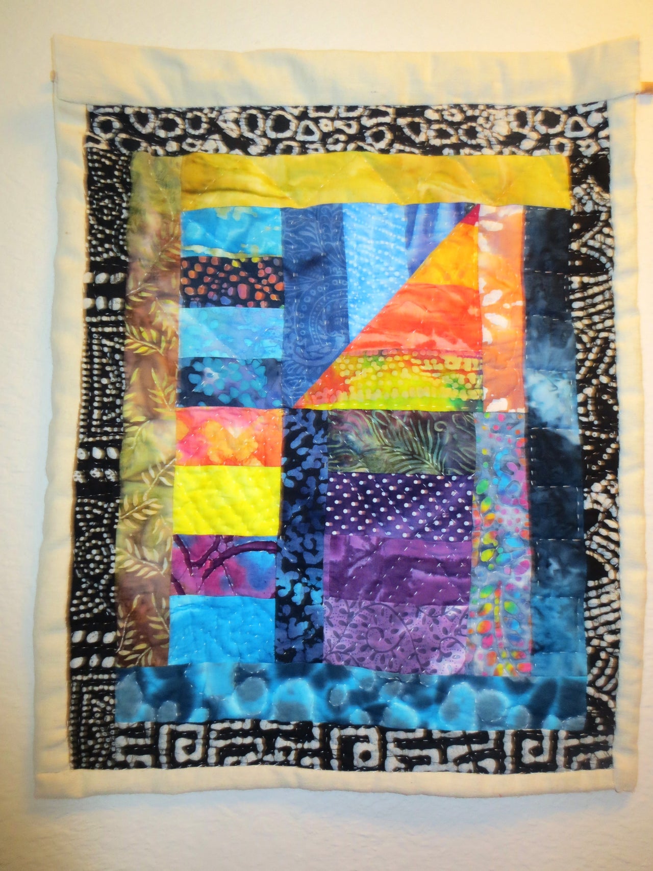 Vibrant Bohemian hand quilted batik wall hanging