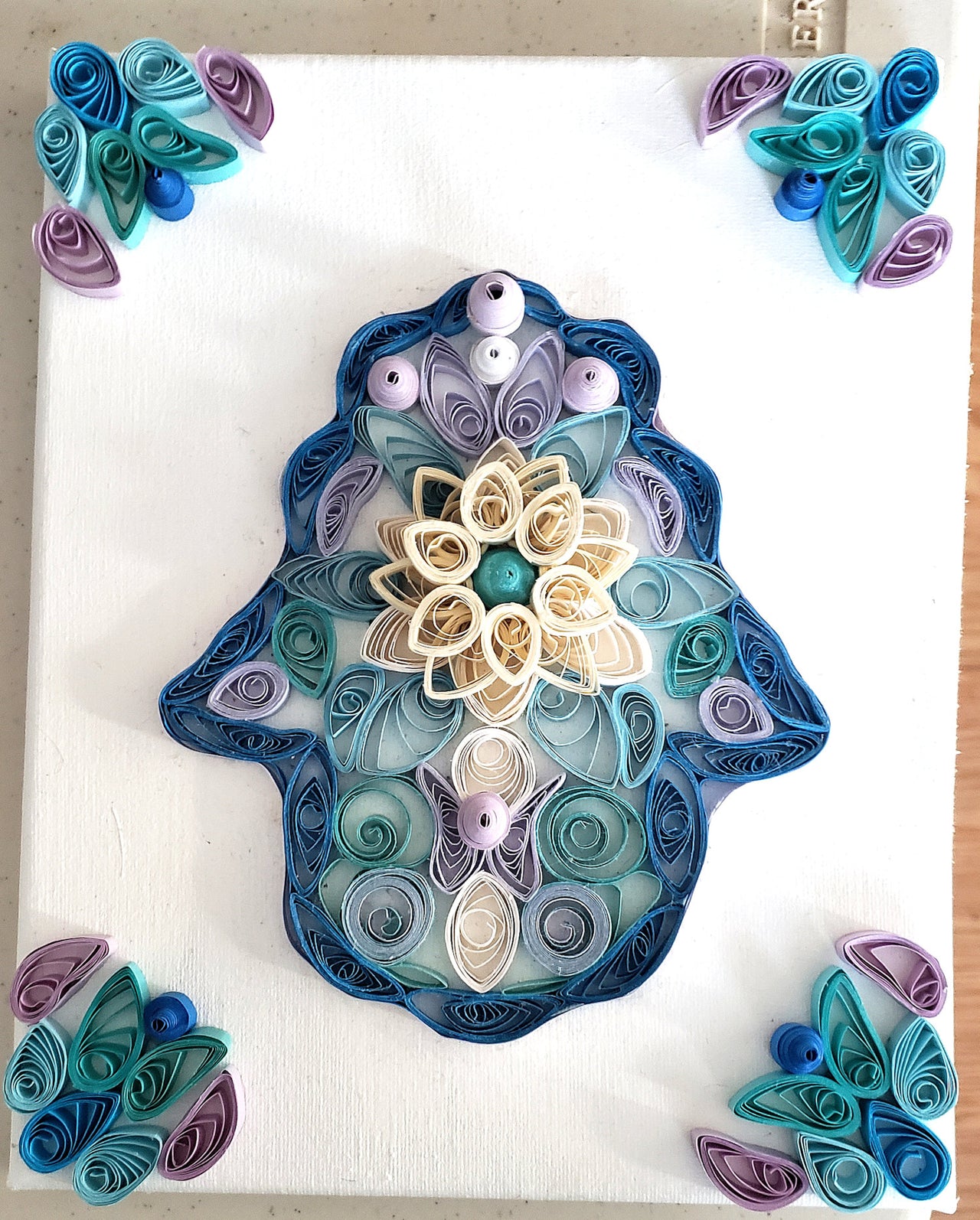 quilled flower hamsa being sold at dag please bid at durham arts guild..see the details