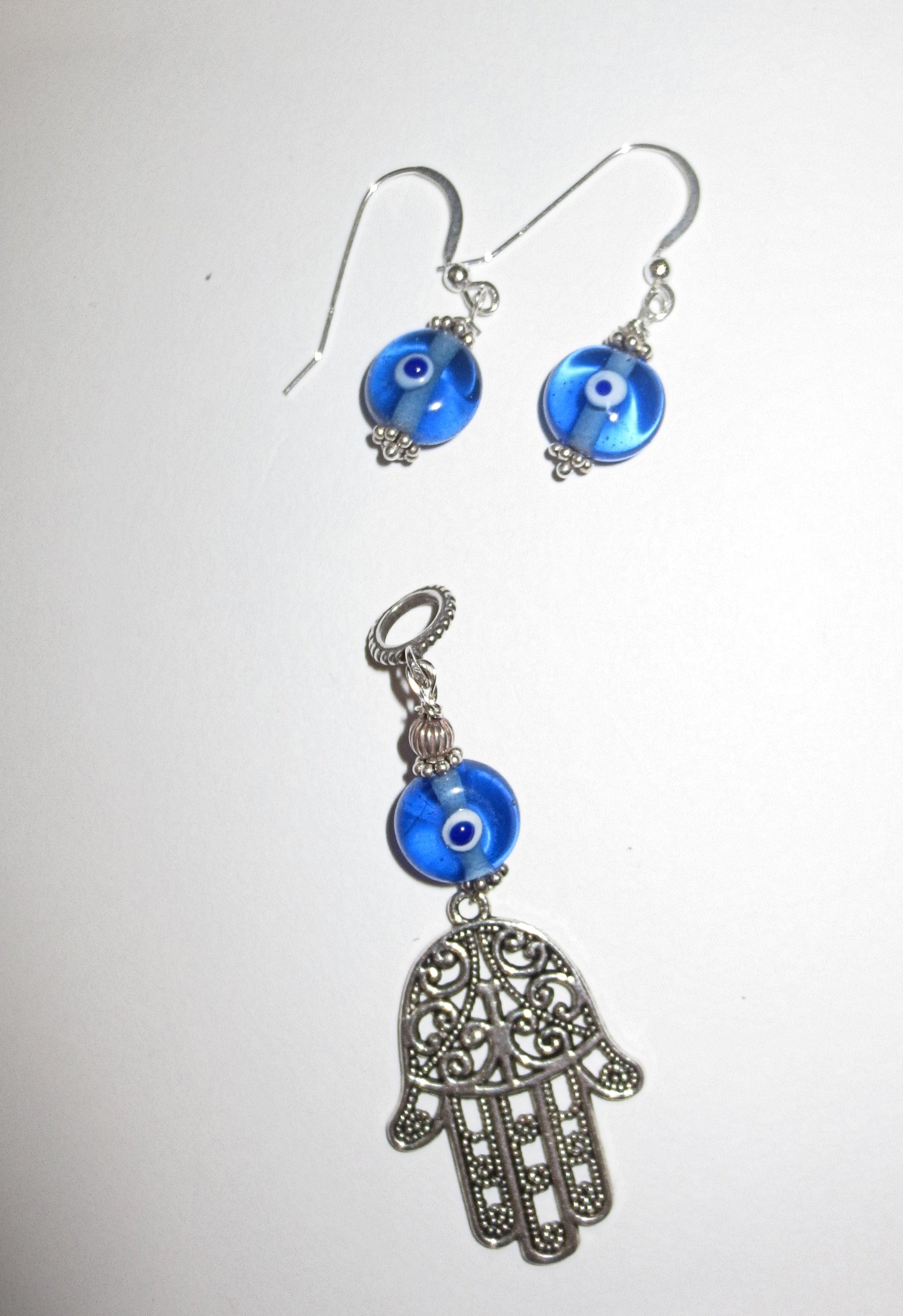 hamsa with evil eye pendant plus matching evil eye earrings