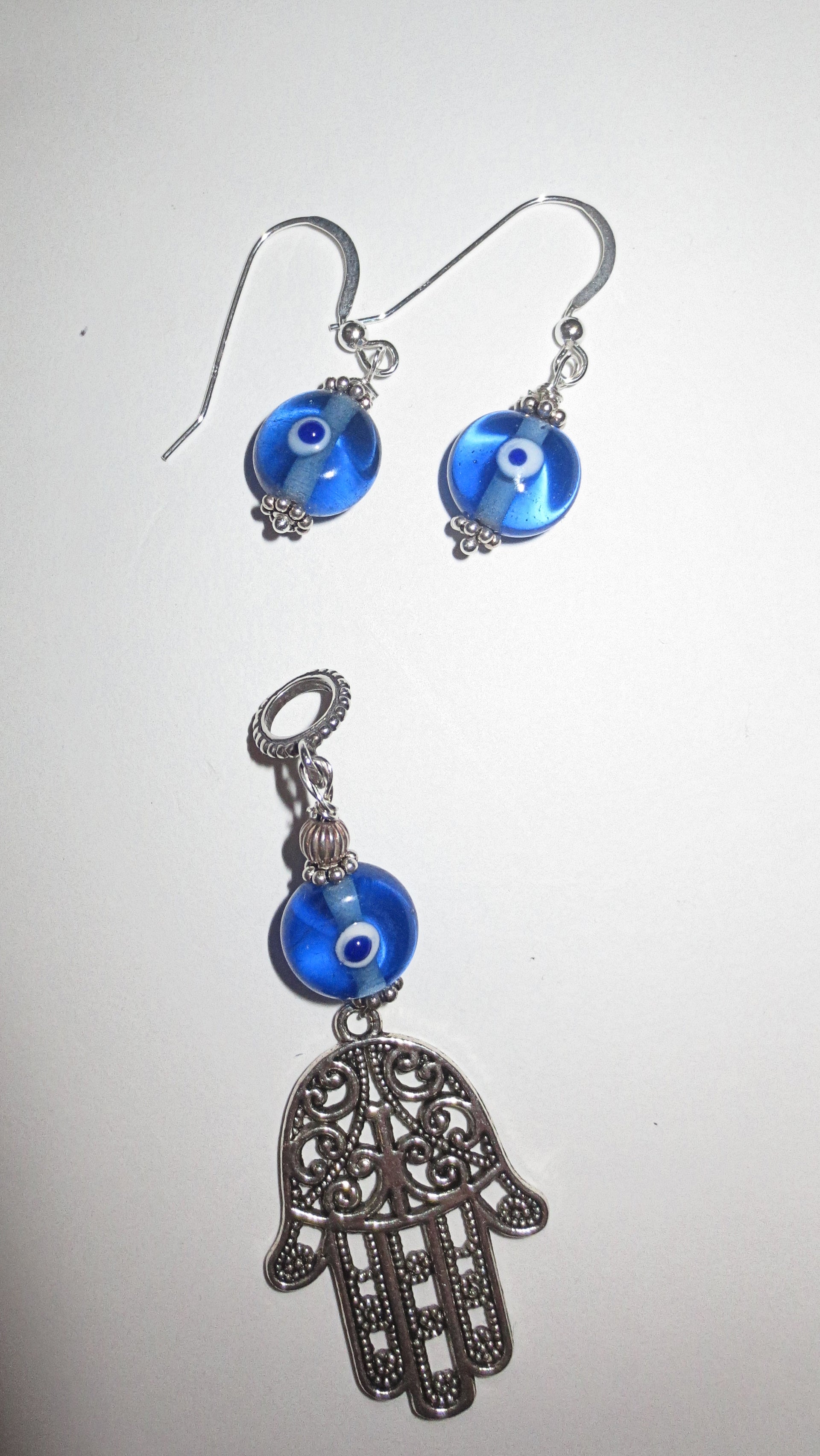 hamsa with evil eye pendant plus matching evil eye earrings