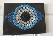 evil eye button art work with vintage buttons on canvas