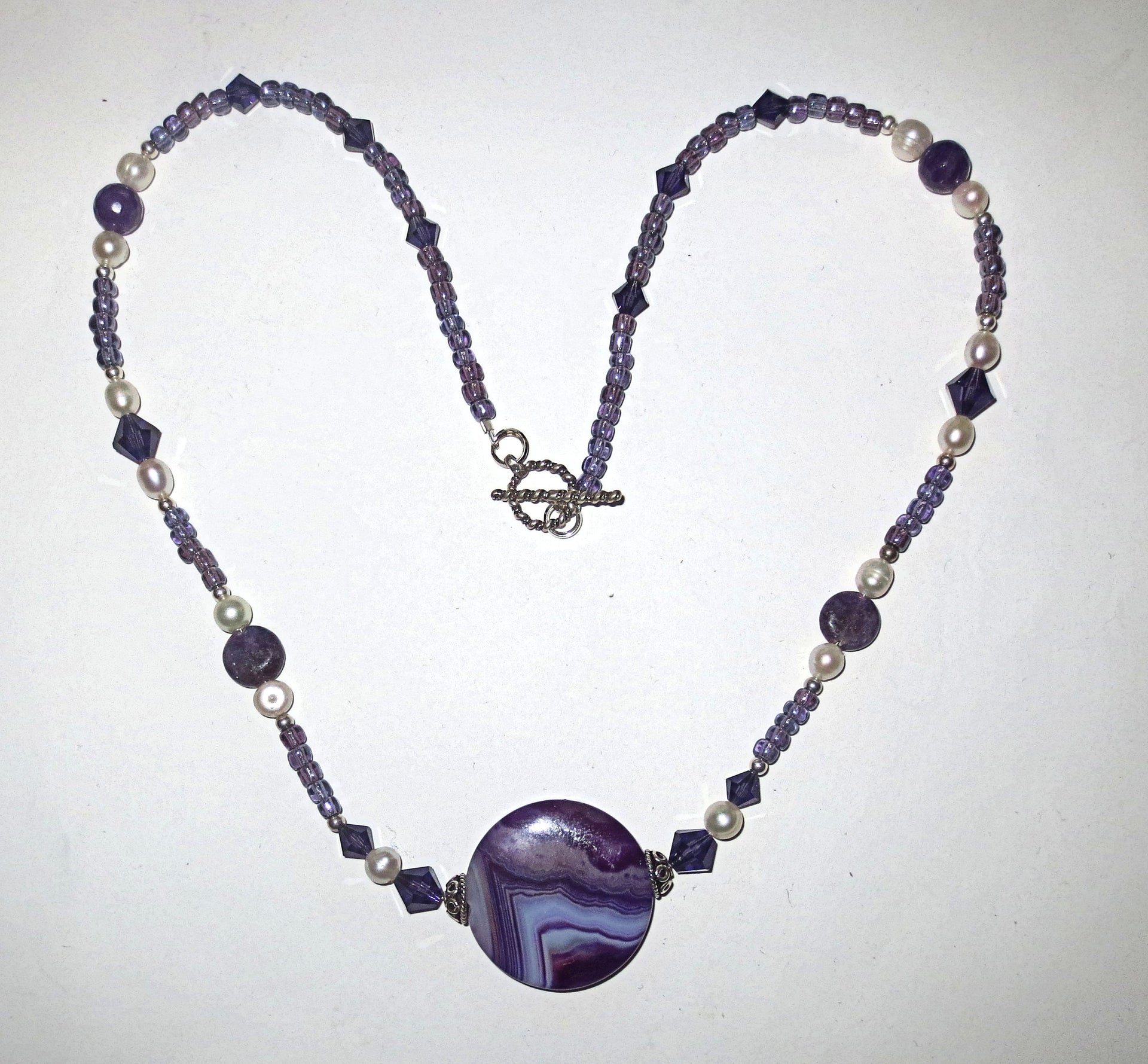 purple gemstones statement necklace with pearls and gorgeous agate main stone