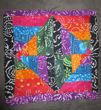 batik colorful pillow cover squares triangles rhombus design reversible. pillow a (black and purple batik on front edges)
