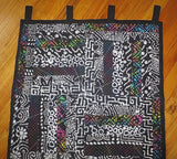 black batik wall hanging with splashes of color one of a kind quilted wall hanging