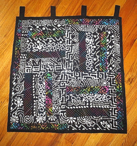 black batik wall hanging with splashes of color one of a kind quilted wall hanging